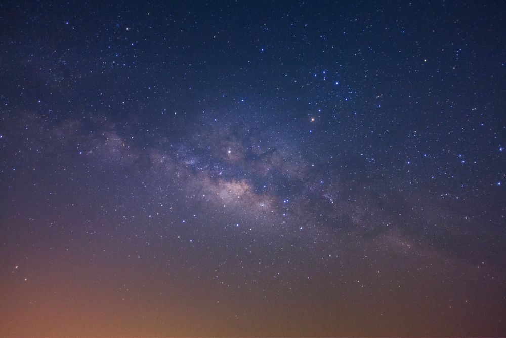 The milky way galaxy with stars and space dust in the universe, Long exposure photograph, with grain