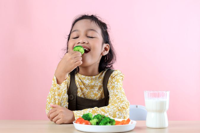 Asian Kids Happy Eating Vegetable Broccoli