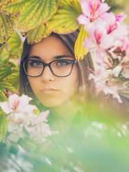Woman on background of stunning violet flowers