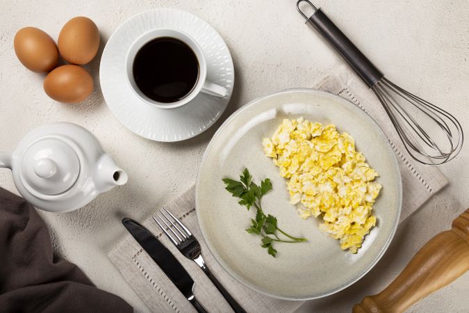 Breakfast with scrambled eggs on the table.