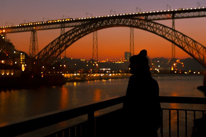 Female walking on embankment during sundown
