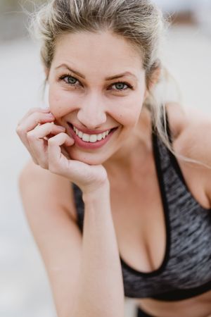 Sportswoman in active clothing smiling