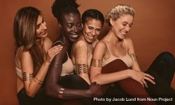 Portrait of smiling female models with different skins 0WPQW5