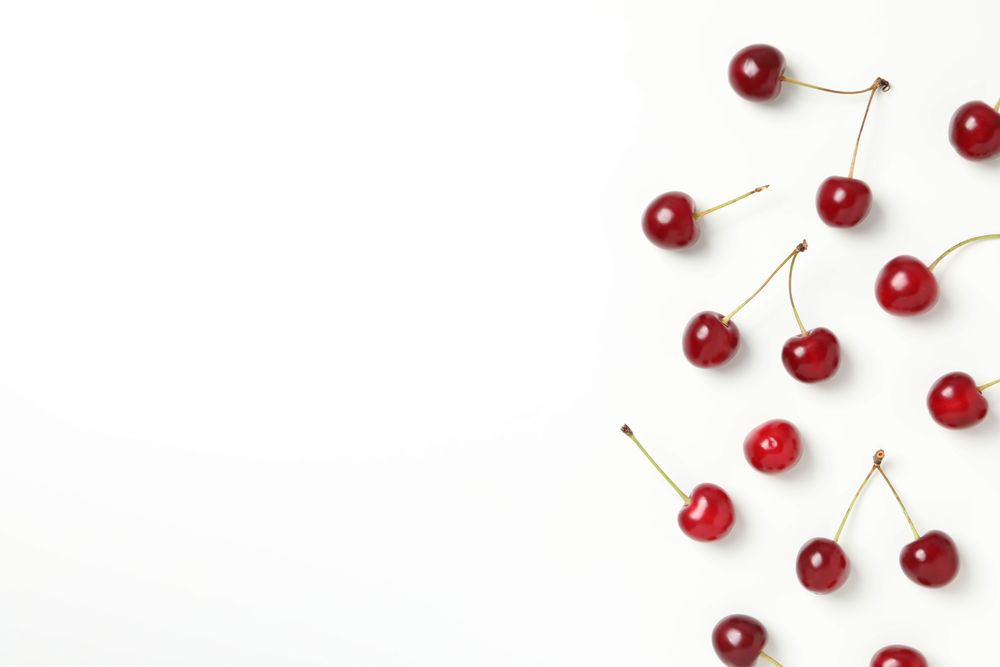 Ripe juicy cherry fruits on a light background