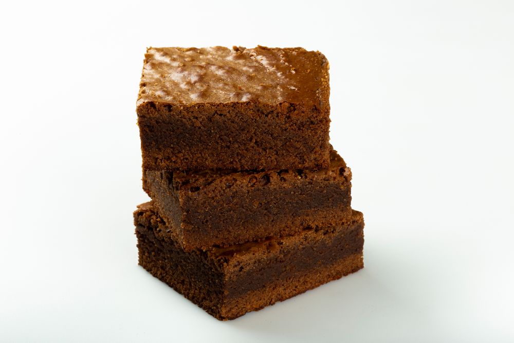 Pile of 3 freshly made chocolate brownies