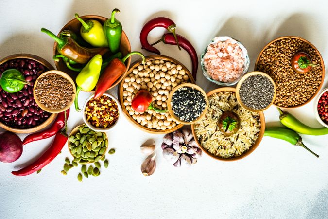 Top view of bowls of legumes and aromatics