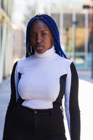Thoughtful Black woman on street
