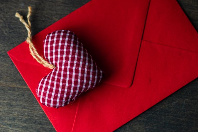 Checkered felt heart decoration on red card 