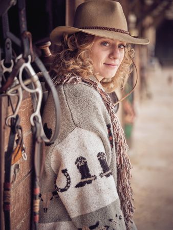 Stylish fair haired female in cowboy wear