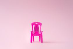 Pink outdoor chair on pink background