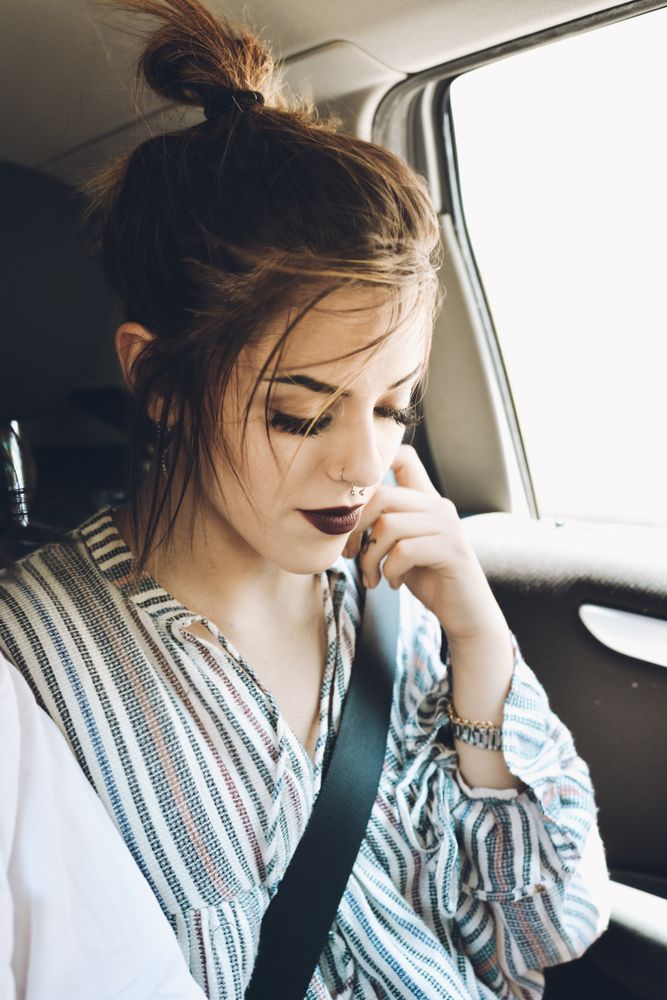 Portrait of woman sitting in the car's.
