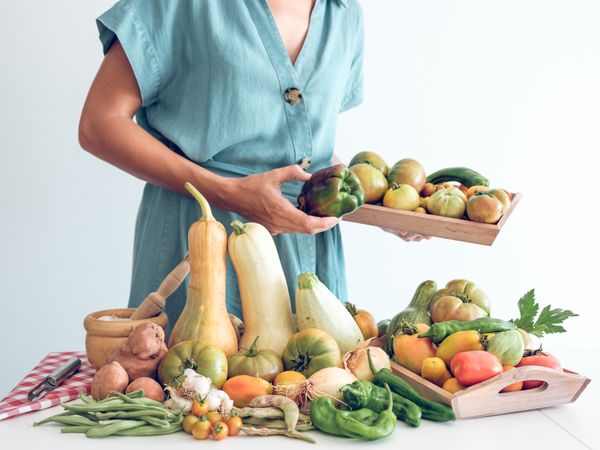 Crop female with fresh vegetables