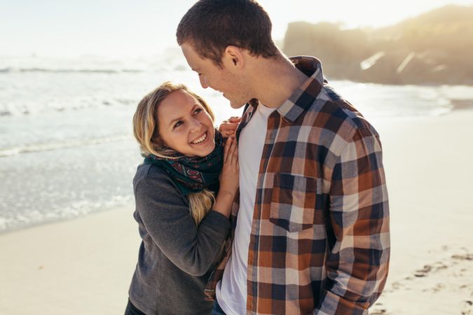 Loving couple standing outdoors at the beach
