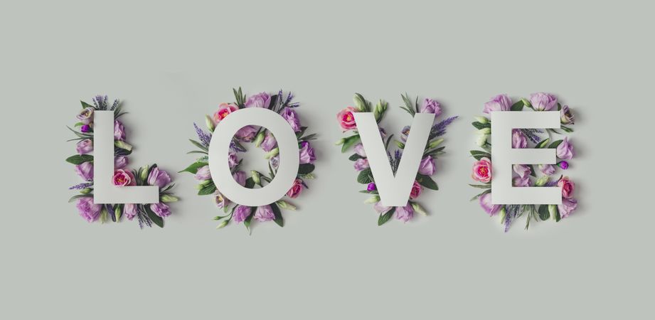 Layout with colorful flowers, leaves and word LOVE