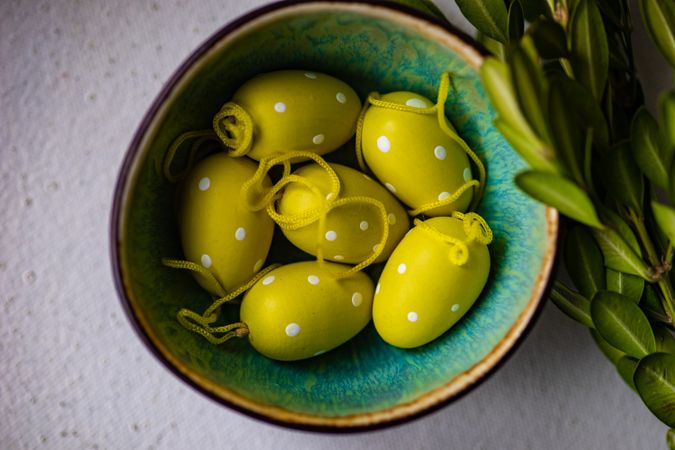 Bowl of yellow decorative eggs