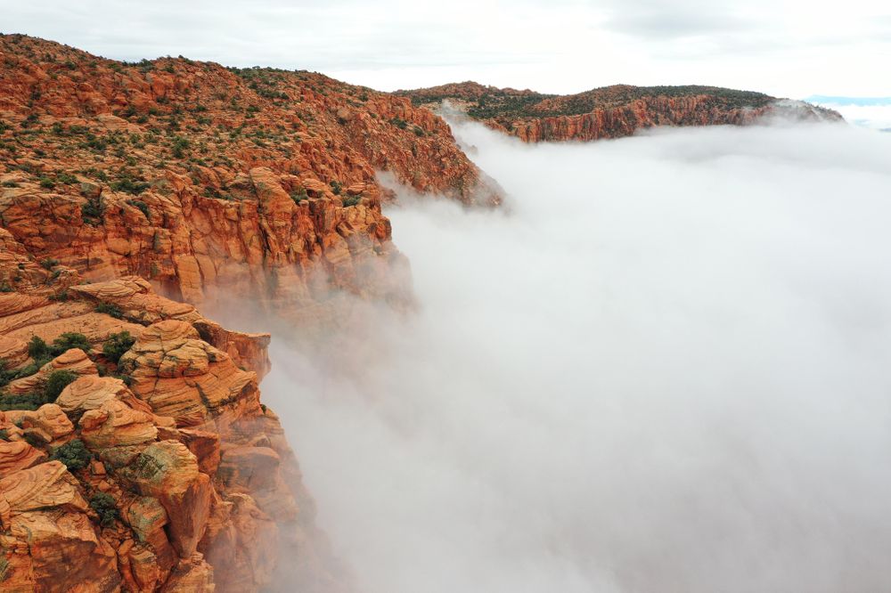 Brown rocky mountain with fog