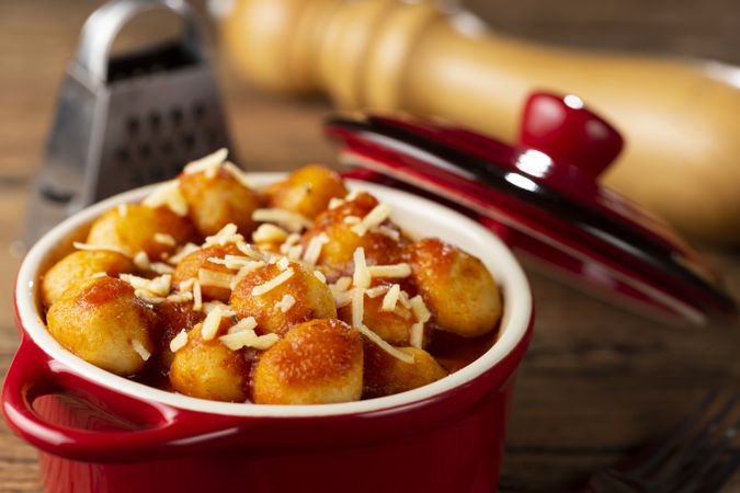 Gnocchi with tomato sauce and grated Parmesan cheese.