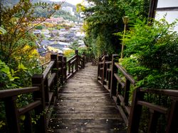 Wooden path with traditional houses in the background