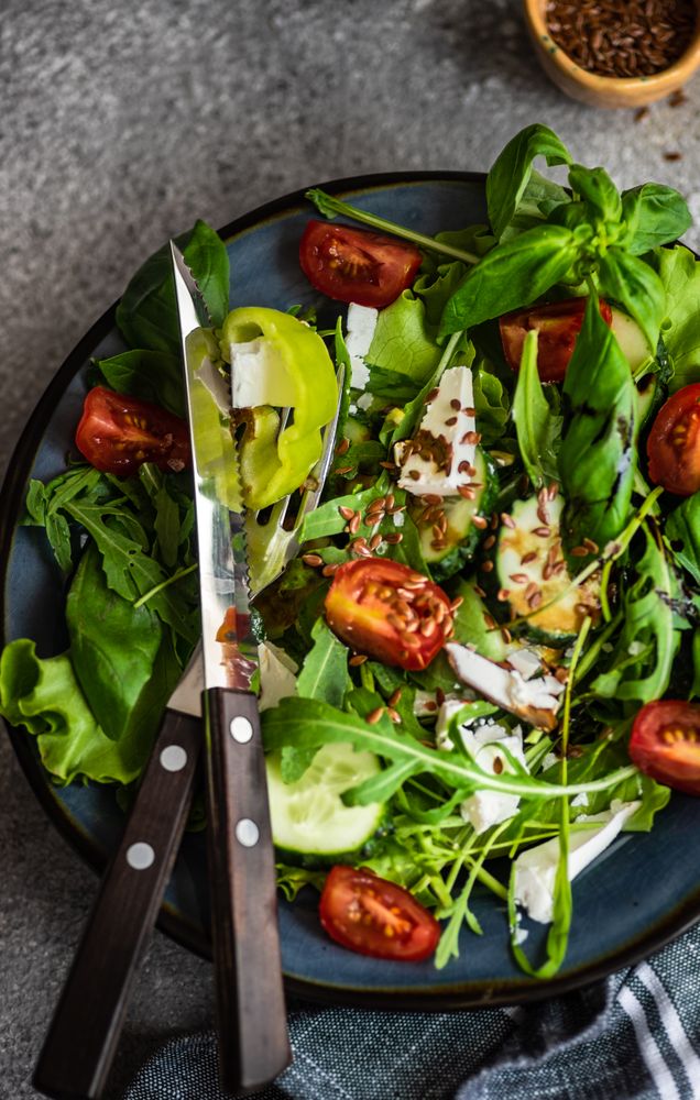 Top view of nutritious salad with flax seeds