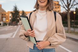 half-portrait of a smiling female student