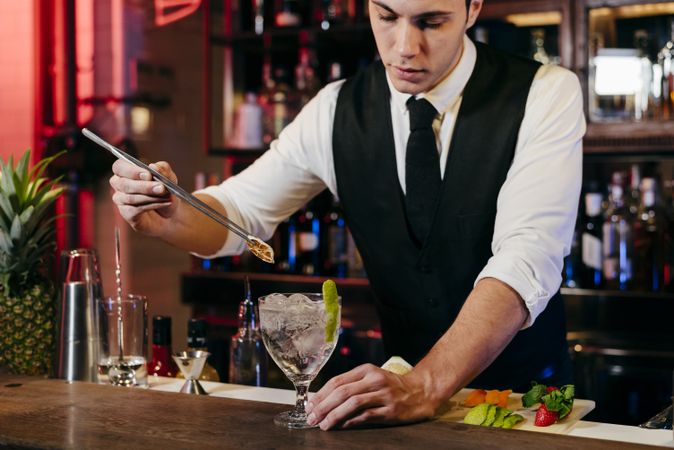 Barman working making drinks