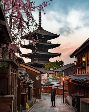 Person standing in an alley in Nineizaka ancient roads in Higashiyama-ku, Kyoto, Japan