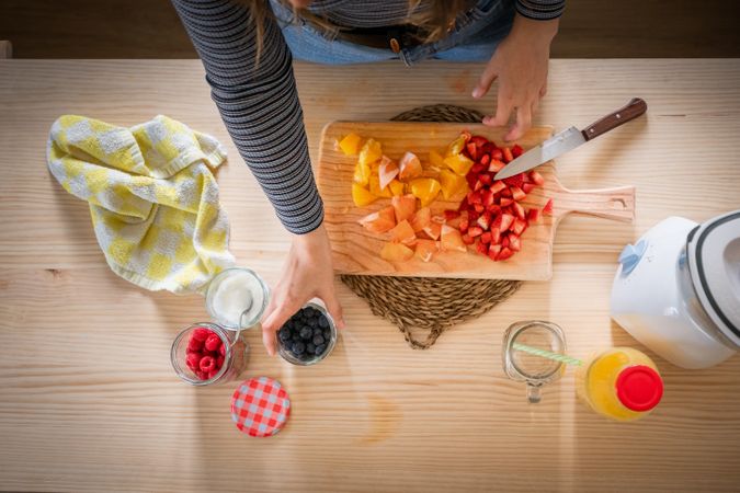 Crop woman preparing healthy food