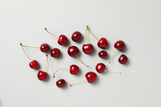 Ripe juicy cherry fruits on a light background