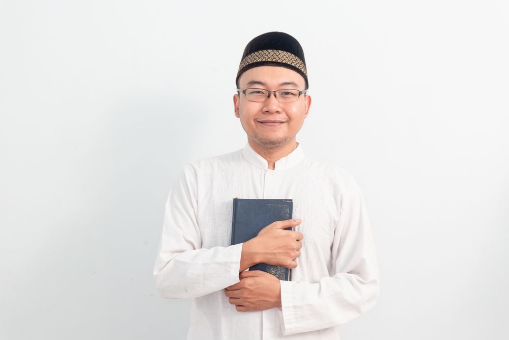 Asian Muslim man  holding quran during Ramadan