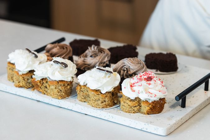 Appetizing carrot cakes on tray in kitchen