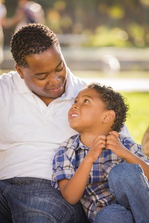 Content Father and Son Sitting Outside
