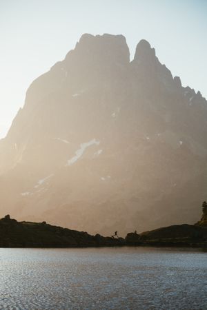 Majestic mountain landscape with human silhouette