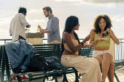 Group of friends eating granita outdoors on vacation