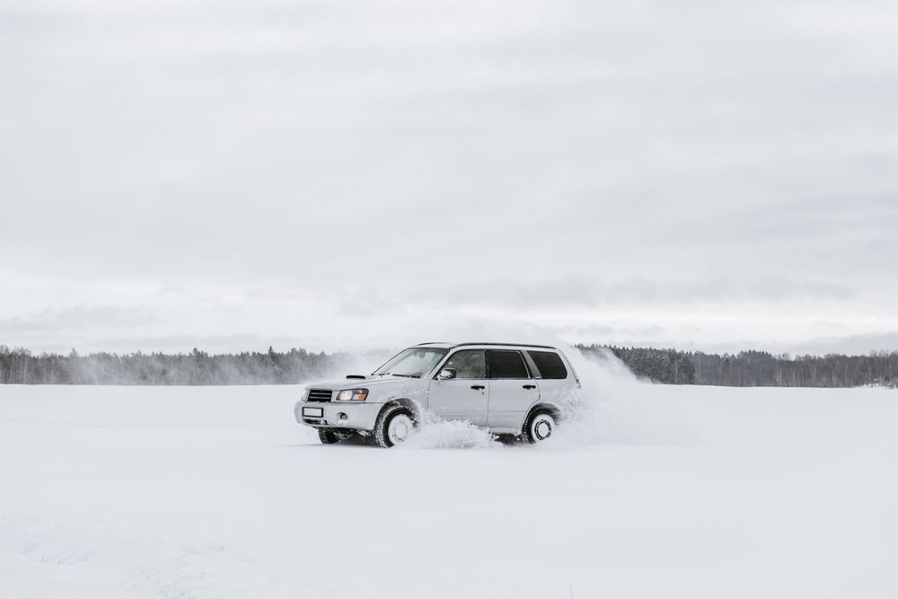 Car driving on snow field