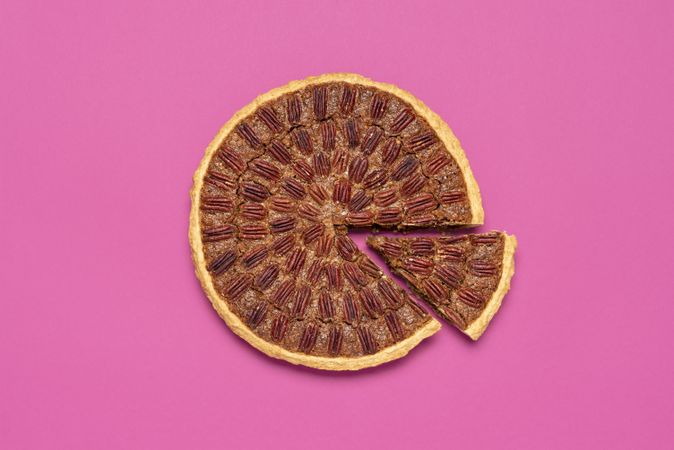 Pecan pie above view, isolated on a pink background