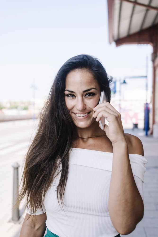 woman talking on mobile phone at street
