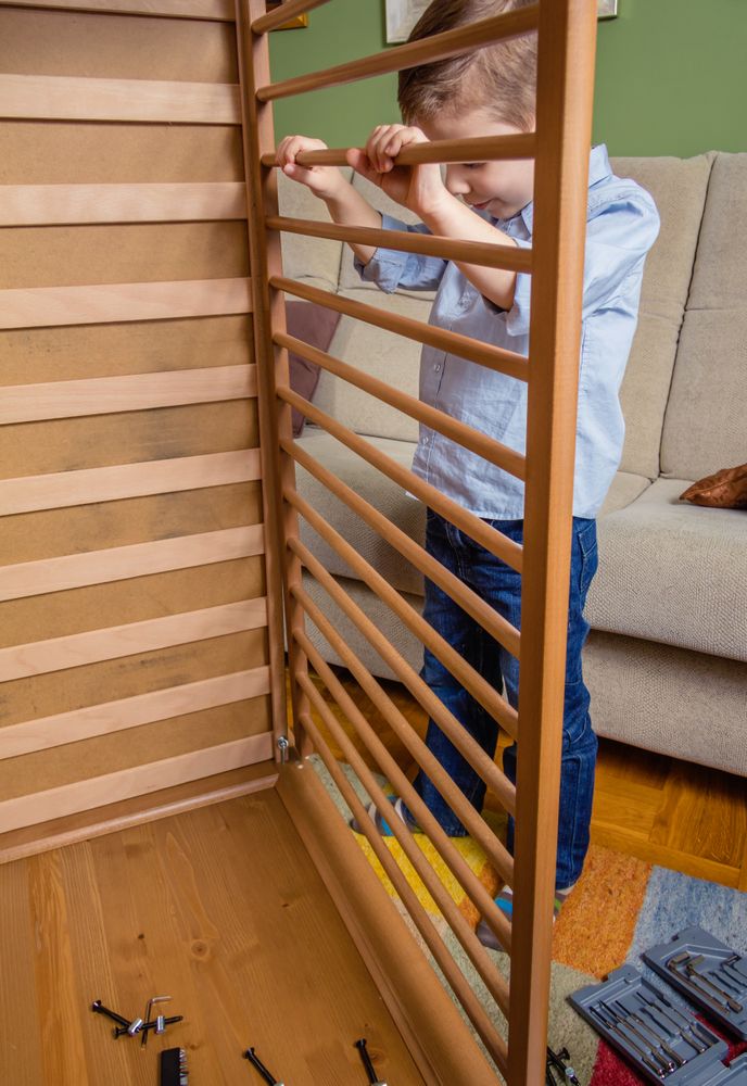 Kid assembling cot for a newborn at home
