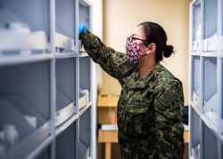 Los Angeles, CA, USA - April 28, 2020: Hospital Corpsman inventories medicine on USNS Mercy