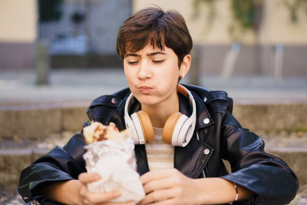 Delighting in a Delicious Snack While Surrounded by a Lively Urban Environment This Summer