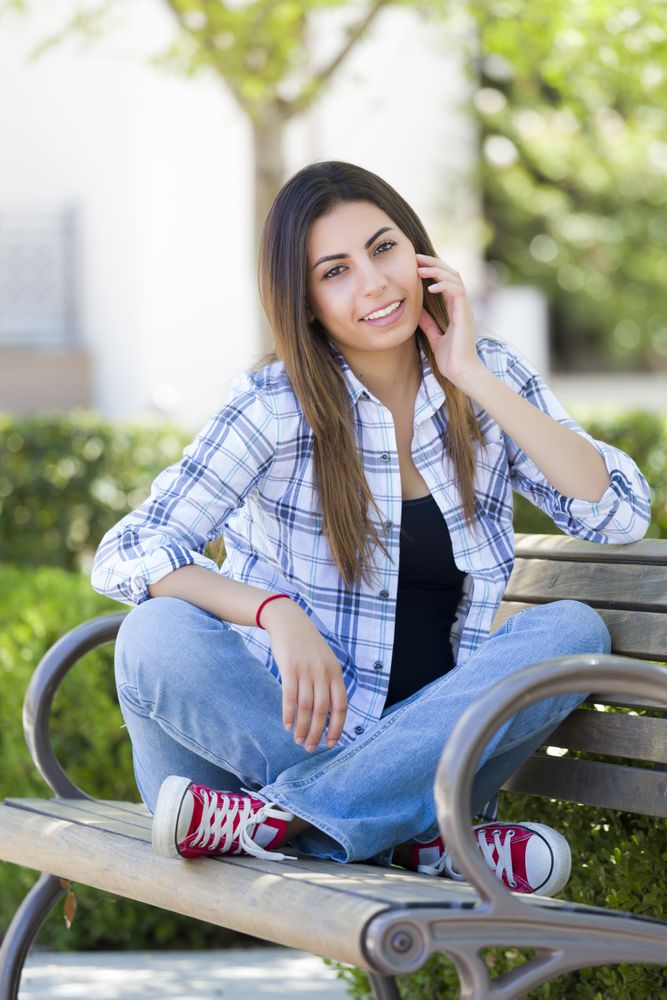 Student Portrait on School Campus Bench