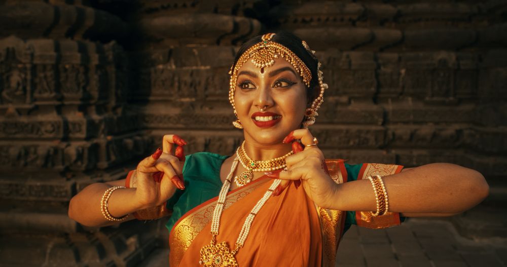 Energetic Indian Woman Showcases the Graceful Movement of Her Legs in Traditional Attire while Dancing Bharatanatyam.