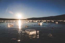 Pieces of ice on cold water