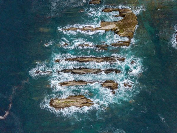 Stone ridges on high seas in stormy day