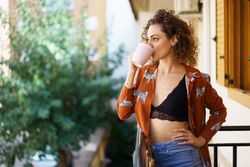 Woman drinking a coffee leisurely at home