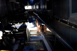 Military woman looking at ceiling of base