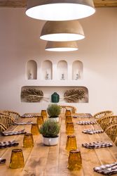 Served table with burning lamps above