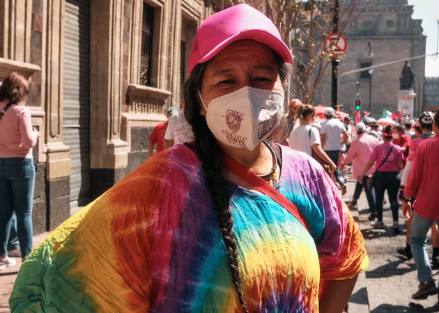 Mexico City, Mexico - February 26th, 2022: Woman in colorful shirt and facemask at protest