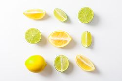 Flat lay composition with citrus on plain background, space for text