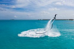 Person jet blading in clear tropical water