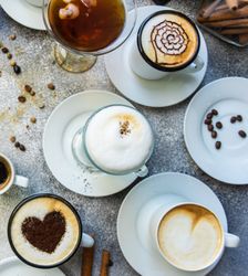 Top view of different coffees with foam art